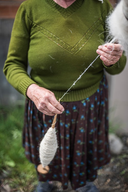 Romania Travel Portrait Photography Documentary Portraiture Portrait of a lady spinning wool Maramures Romania