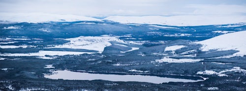 Scotland Landscape Photography Loch Morlich covered in snow in winter Aviemore Cairngorms National Park Scotland United Kingdom Europe