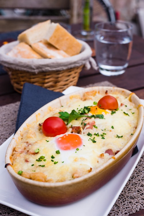 Slovenia Travel Photography Ljubljana cafe culture Cheese bake in one of the many cafes on the waterfront Slovenia Europe
