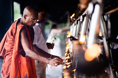 Sri Lanka Documentary Travel Photography Sacred City of Anuradhapura Buddhist monk praying at Sri Maha Bodhi in the Mahavihara The Great Monastery Sri Lanka Asia