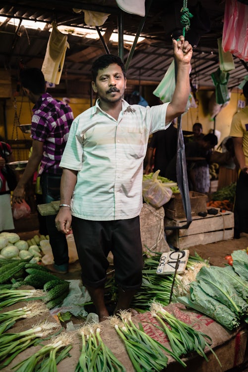 Sri Lanka Portrait Travel Photography Kandy vegetable market vegetable seller at his market stall Kandy Central Province Sri Lanka Highlands Asia