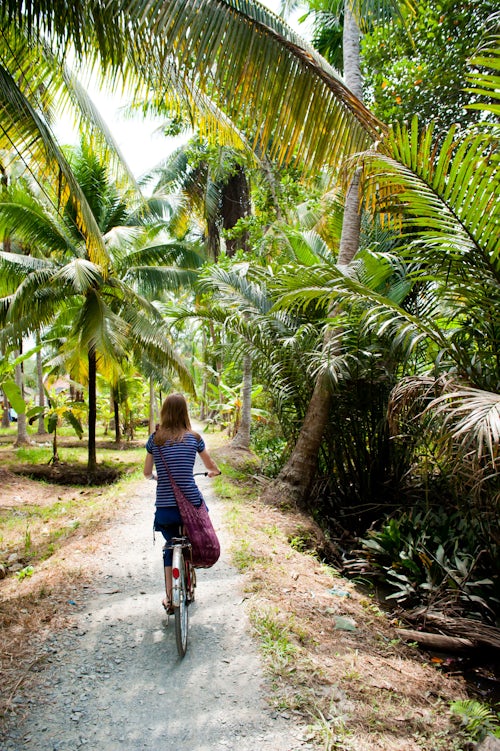 Vietnam Travel Photography Tourist Cycling in Can Tho Mekong Delta Vietnam Southeast Asia