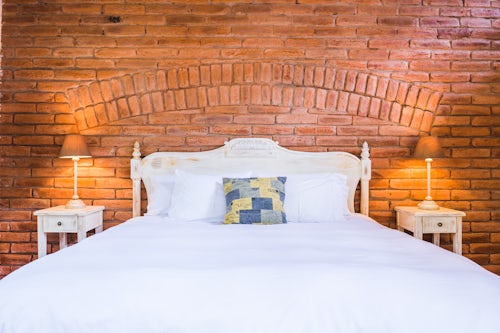 Architecture and Hotel Photography by Professional Freelance Hotel Property and Resort Photographer in London England UK Bedroom at luxury house and hotel