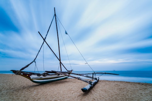 Landscape Photography by Professional Freelance UK Landscape Photographer Outrigger fishing boat on Negombo Beach at sunrise Sri Lanka Asia