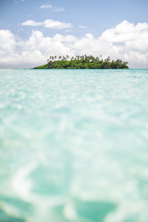 Landscape Photography by Professional Freelance UK Landscape Photographer Tropical Island of Motu Taakoka covered in Palm Trees in Muri Lagoon Rarotonga Cook Islands
