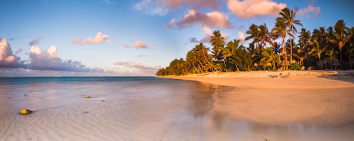 Landscape Photography by Professional Freelance UK Landscape Photographer Tropical beach with palm trees at sunrise Rarotonga Cook Islands